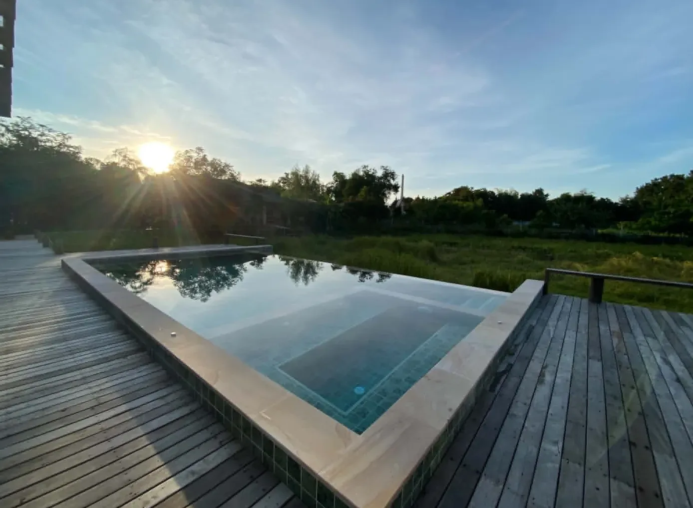 The lap pool at Chann Jiva on its timber deck, at the end of the afternoon